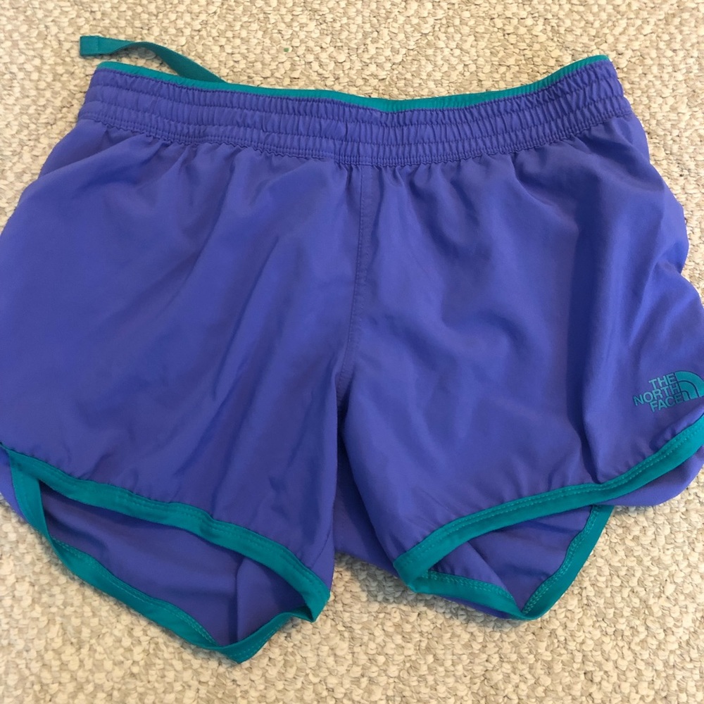 North face brand womens size small purple and teal running shorts. VGUC.